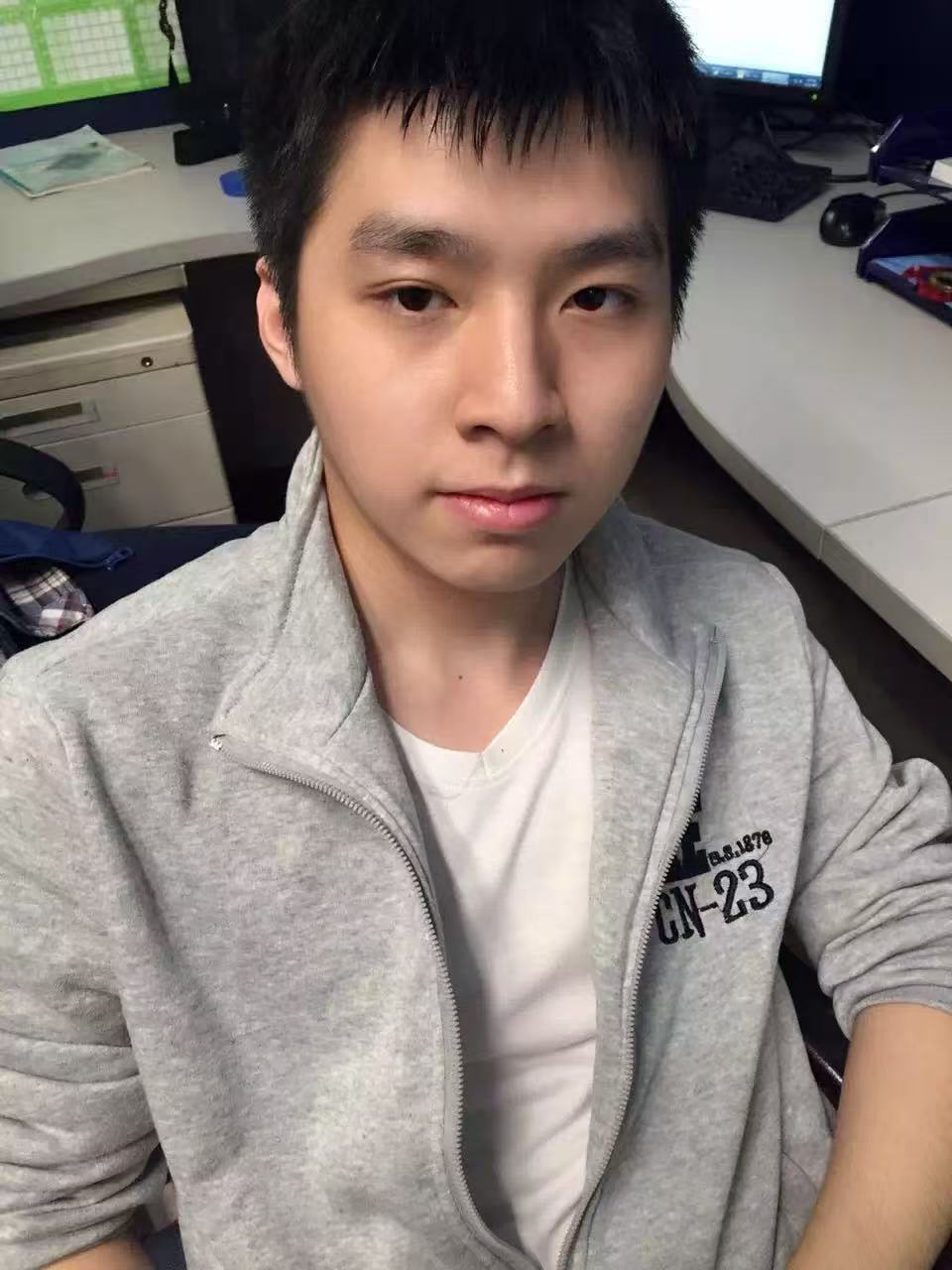 A man in a alice blue shirt with a thinking expression